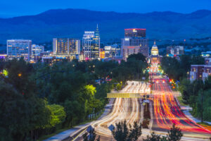 Boise cityscape at night with traffic light.